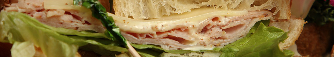 Eating Sandwich Cafe at Riverwalk Bakery & Café restaurant in Nashua, NH.